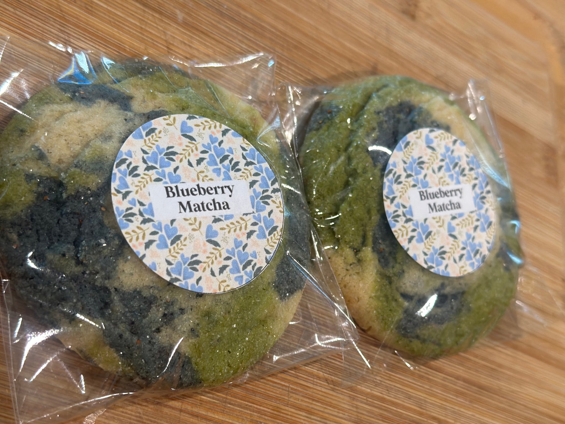 Blueberry Matcha cookie with vibrant green matcha dough and bursts of dried blueberries – available for local pickup or nationwide shipping.